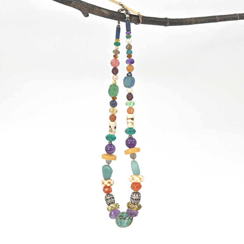 Colourful beaded necklace with turquoise, amethyst, carnelian, Lapis lazuli, and rose quartz stones, and beads made from bone, crystal, sterling silver, flame-worked and recycled glass. Designed and handcrafted by Ula Frou creator Sadie Hodson on Salt Spring Island.